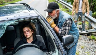 The brakes failed on a lonely Smoky Mountain road, and our car went over the edge. As I lay trapped beneath twisted metal, a trucker appeared at the broken window and whispered, “Play dead… he’s still watching.” Only after my stepson finally left did the stranger reveal the truth he had been hiding.